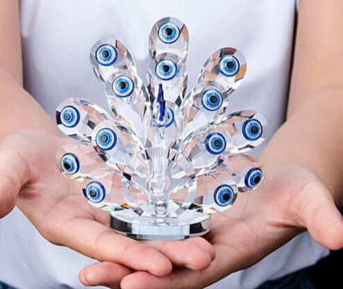 Protege tu hogar con estilo: descubre el poder del Ojo Turco y la elegancia del pavo real en una sola pieza.