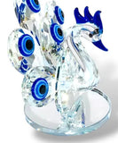 Protege tu hogar con estilo: descubre el poder del Ojo Turco y la elegancia del pavo real en una sola pieza.