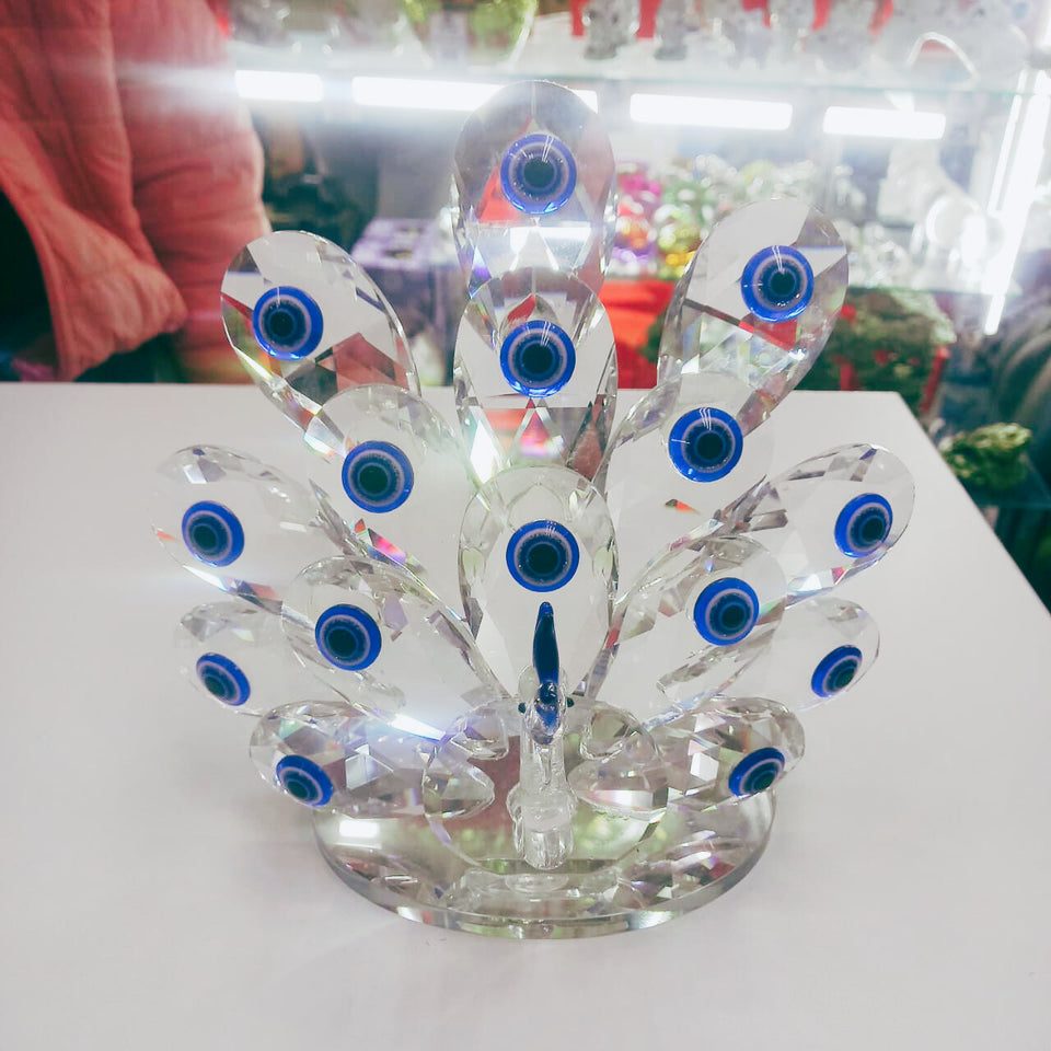 Protege tu hogar con estilo: descubre el poder del Ojo Turco y la elegancia del pavo real en una sola pieza.