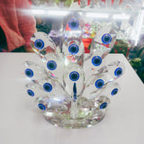 Protege tu hogar con estilo: descubre el poder del Ojo Turco y la elegancia del pavo real en una sola pieza.